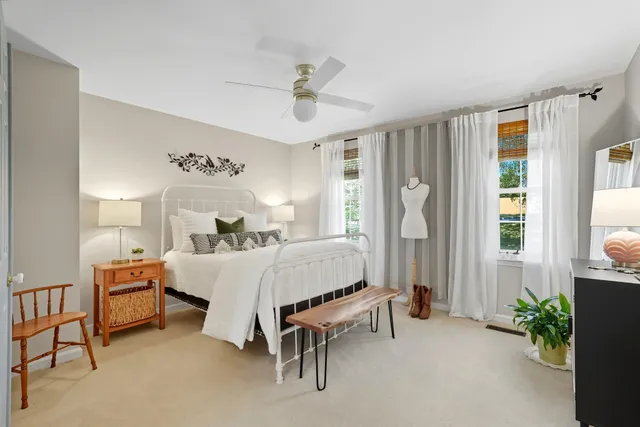 a bed room with a bed and a window