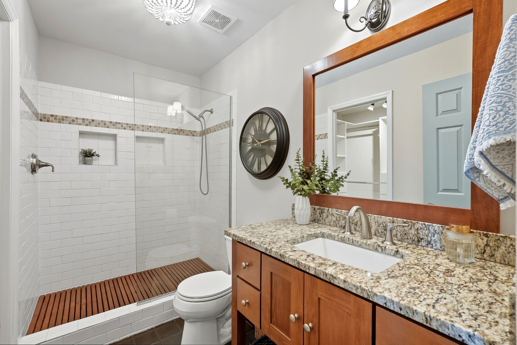 401 Huntington Ridge Drive Nashville, TN 37211 - Photo 19 of 38 a bathroom with a granite countertop toilet a sink and a large mirror