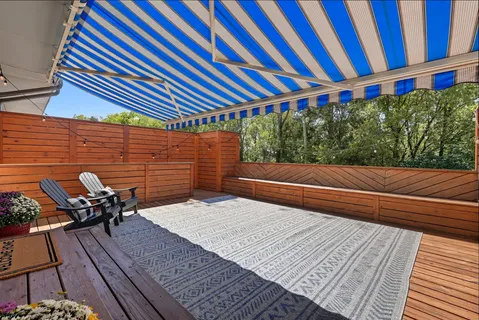 a backyard of a house with outdoor seating