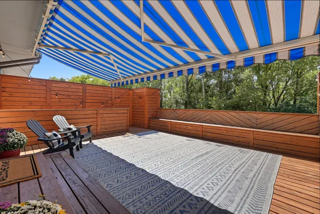 a backyard of a house with outdoor seating