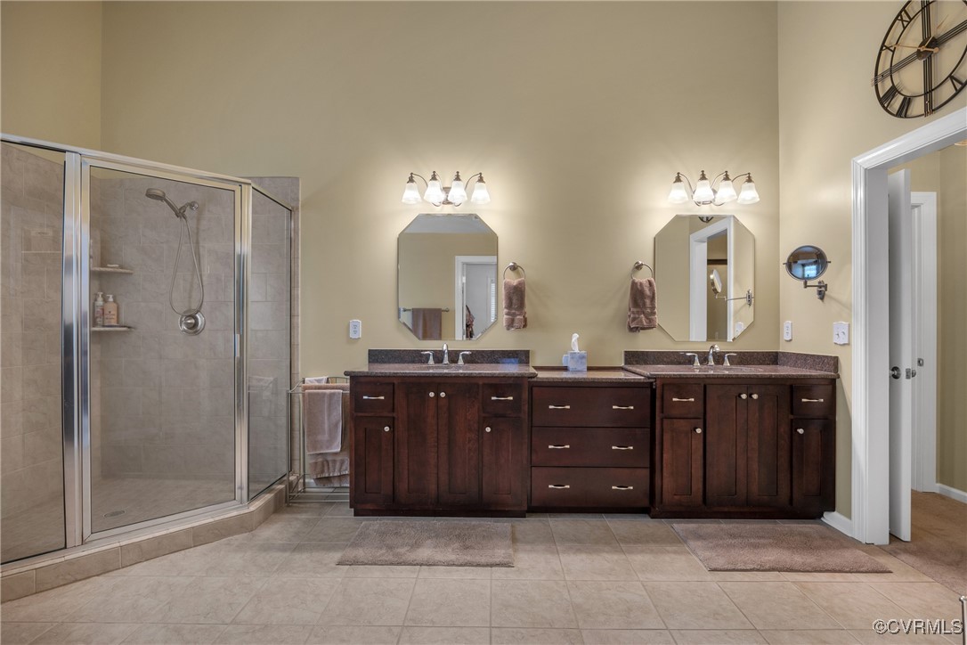 14022 Redhills Road Beaverdam, VA 23015 - Photo 26 of 50 Primary bathroom with double vanity, tile patterne