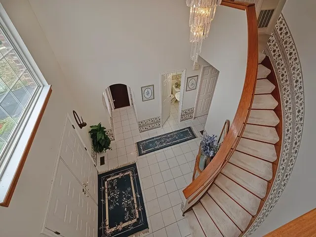 a view of an entryway with wooden floor