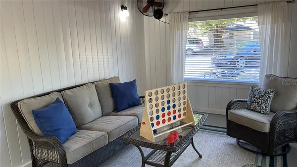 a living room with furniture and a window