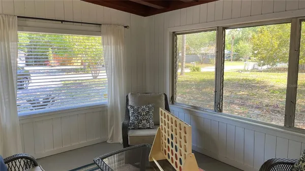 a view of a room that has a bed in it