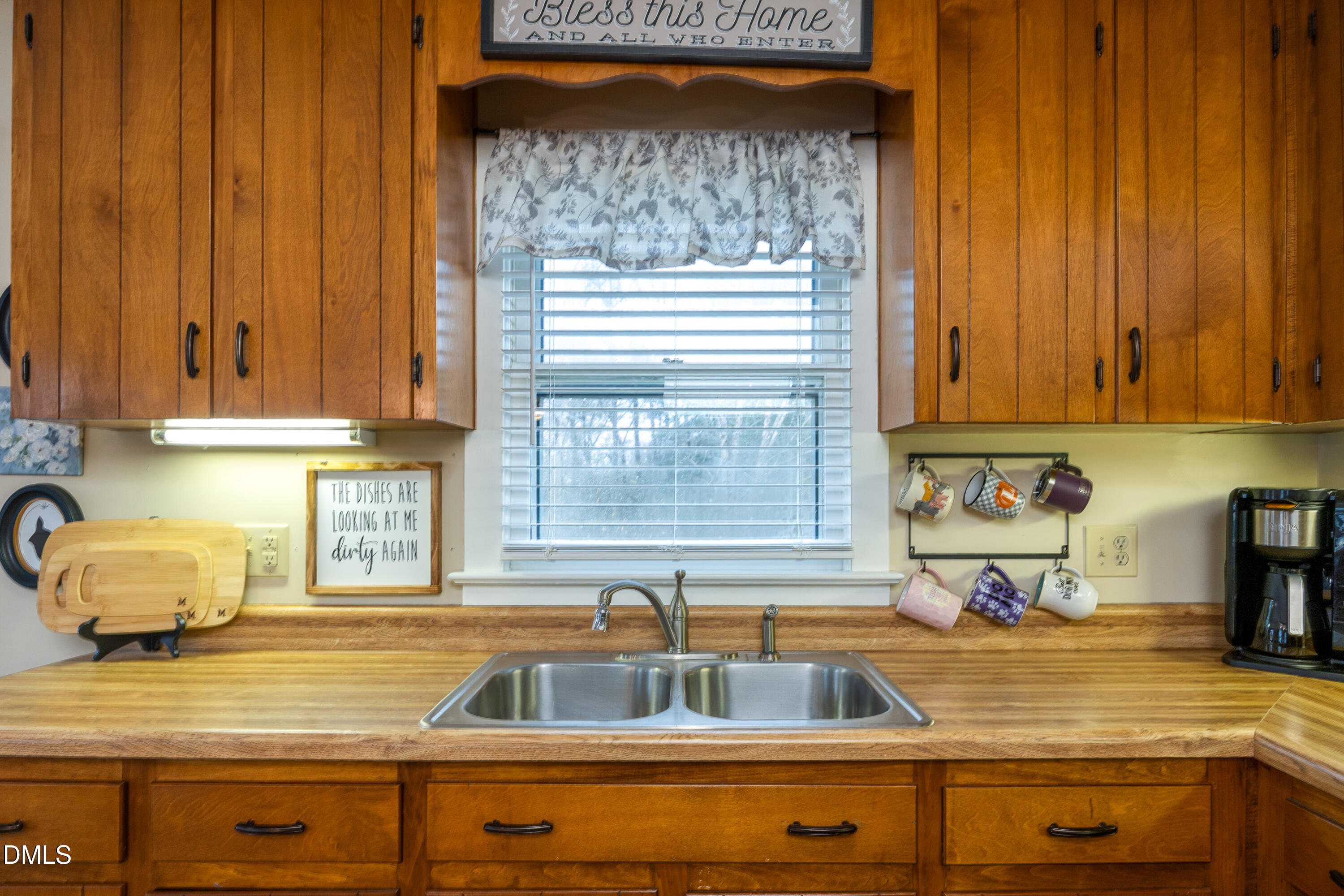 1854 Pope Road Dunn, NC 28334 - Photo 11 of 27 a kitchen with a sink and cabinets