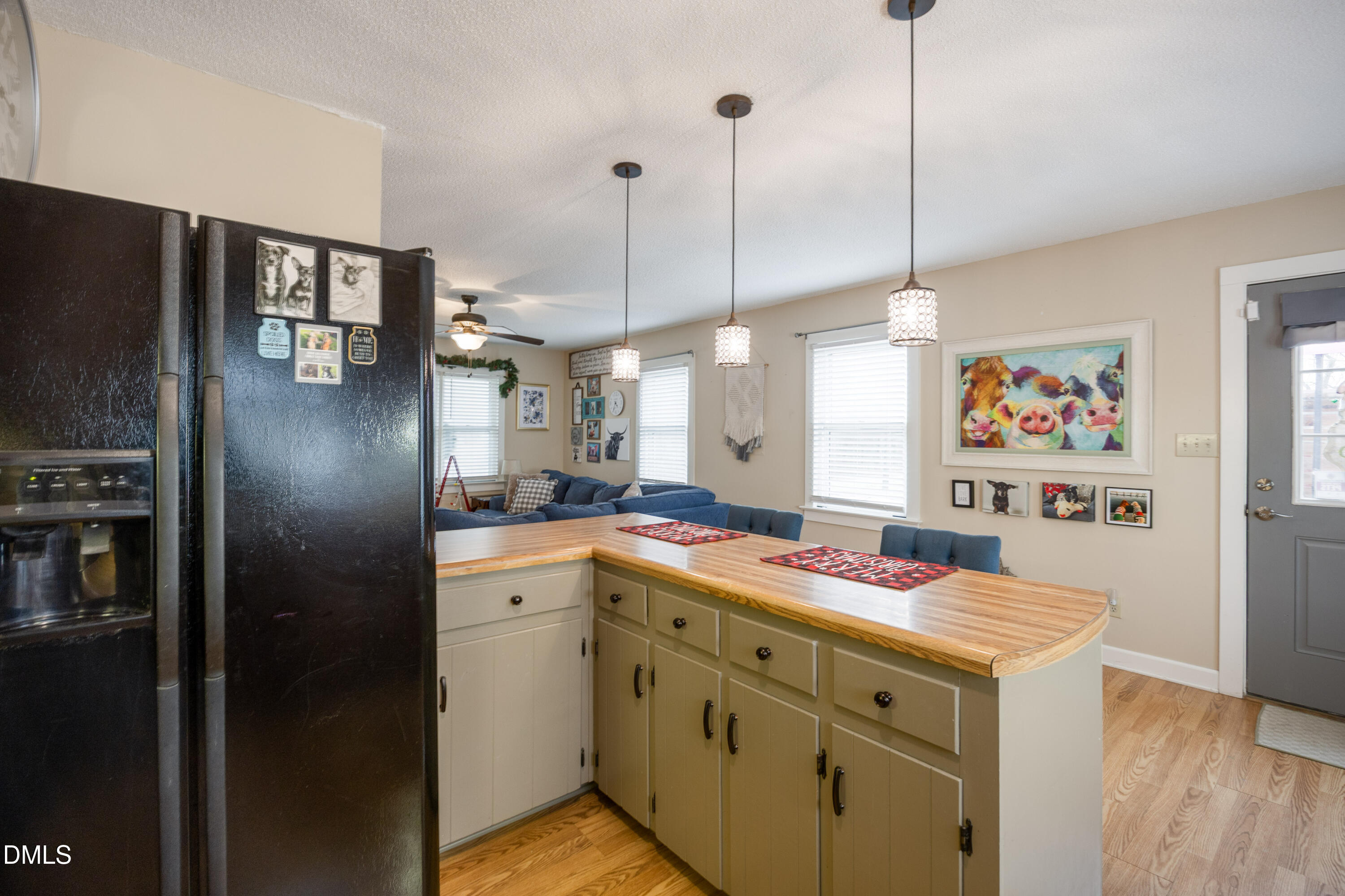 1854 Pope Road Dunn, NC 28334 - Photo 13 of 27 a kitchen with kitchen island a counter top space stainless steel appliances and cabinets