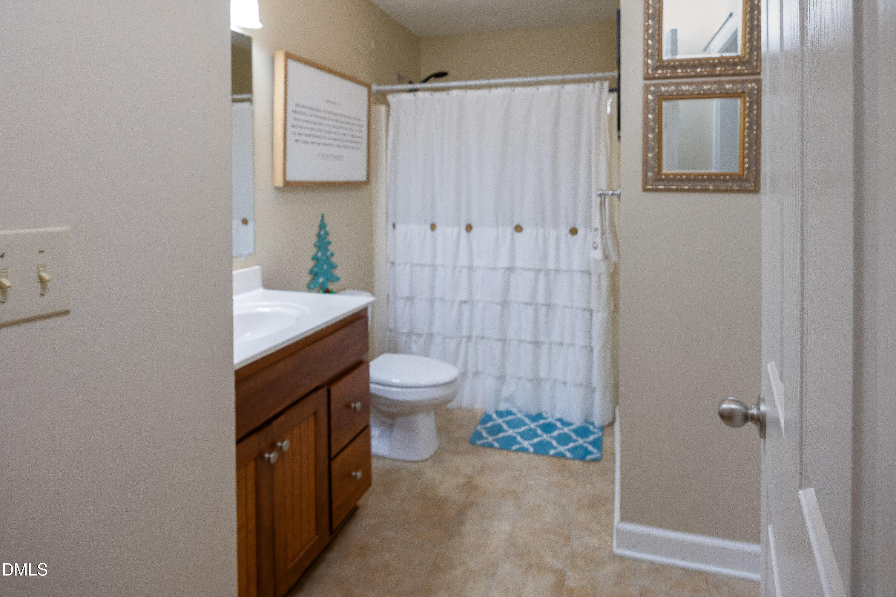 1854 Pope Road Dunn, NC 28334 - Photo 15 of 27 a bathroom with a toilet a sink and shower