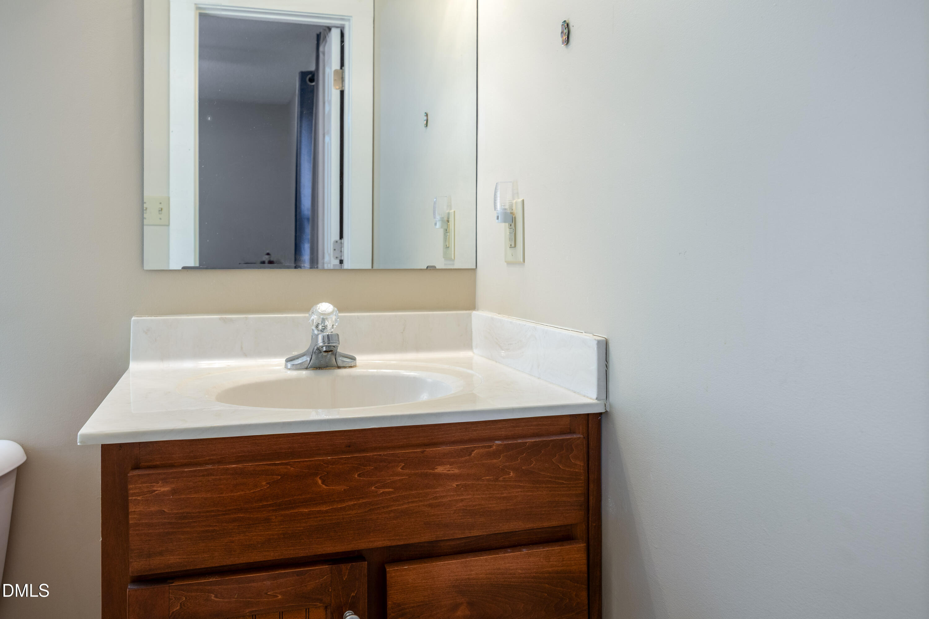 1854 Pope Road Dunn, NC 28334 - Photo 19 of 27 a bathroom with a sink vanity and a mirror