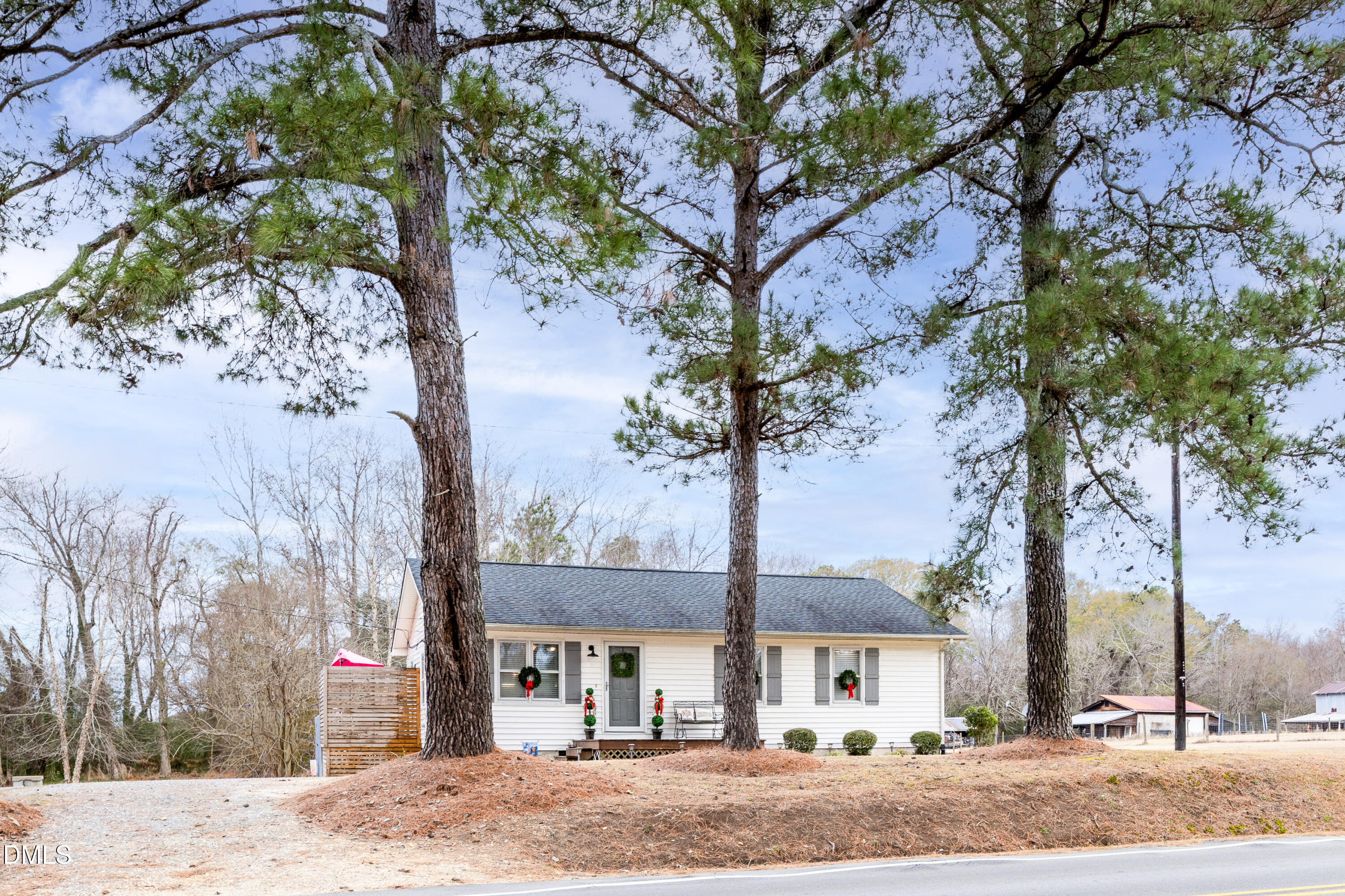 1854 Pope Road Dunn, NC 28334 - Photo 2 of 27 a front view of a house with a yard and tree s