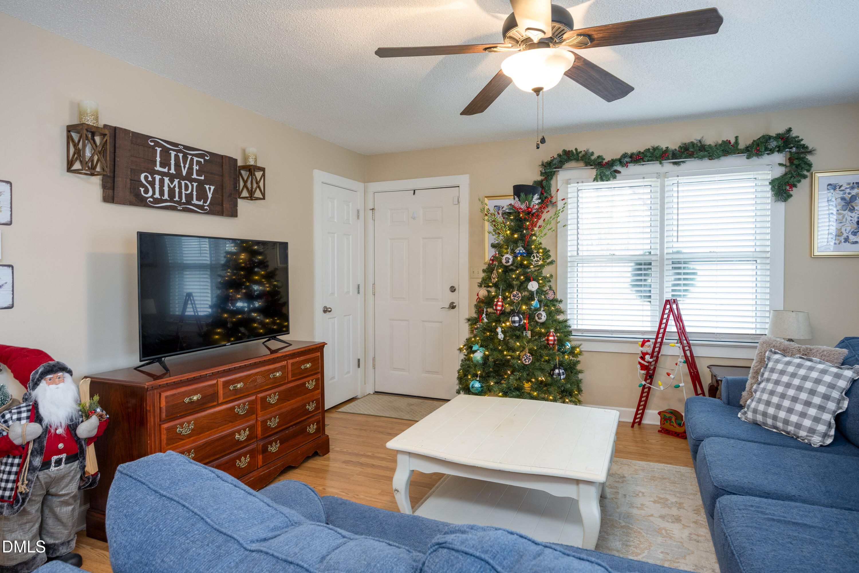1854 Pope Road Dunn, NC 28334 - Photo 8 of 27 a living room with furniture and a flat screen tv