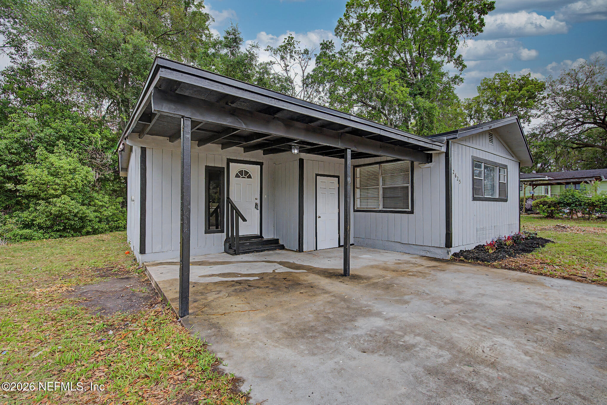 2625 Kohn Road Jacksonville, FL 32210 - Photo 2 of 34 a view of house with tree in front of it