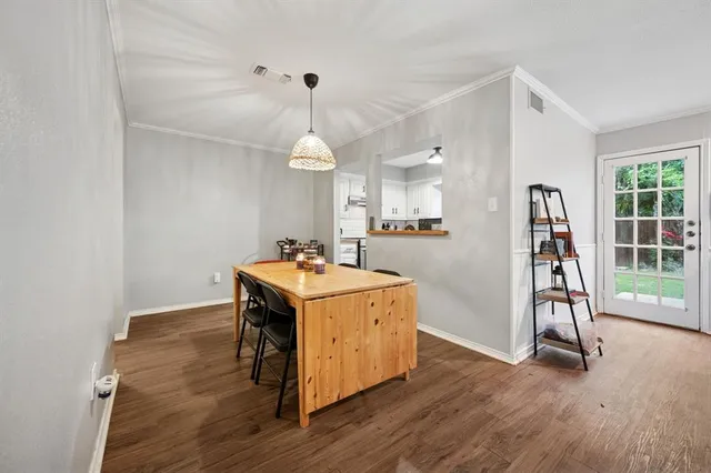 a view of a kitchen with a sink and a refrigerator