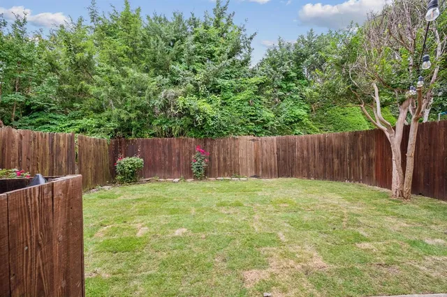 a view of outdoor space with wooden fence