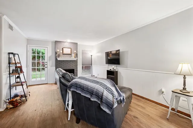 a view of a livingroom with furniture and a flat screen tv
