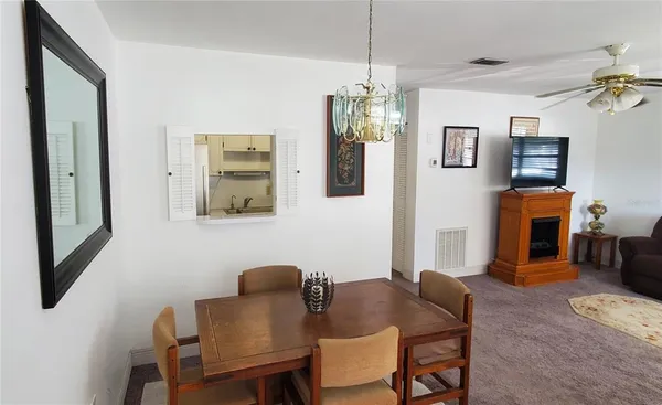 a view of a dining room with furniture