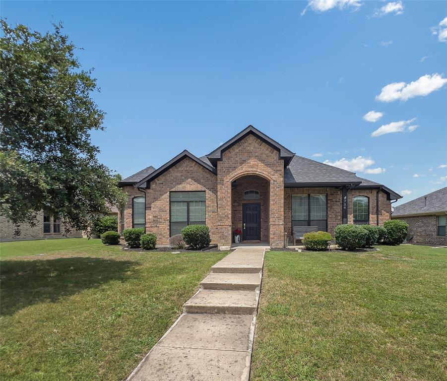734 Brazos Way Rockwall, TX 75032 - Photo 1 of 1 a front view of a house with a yard