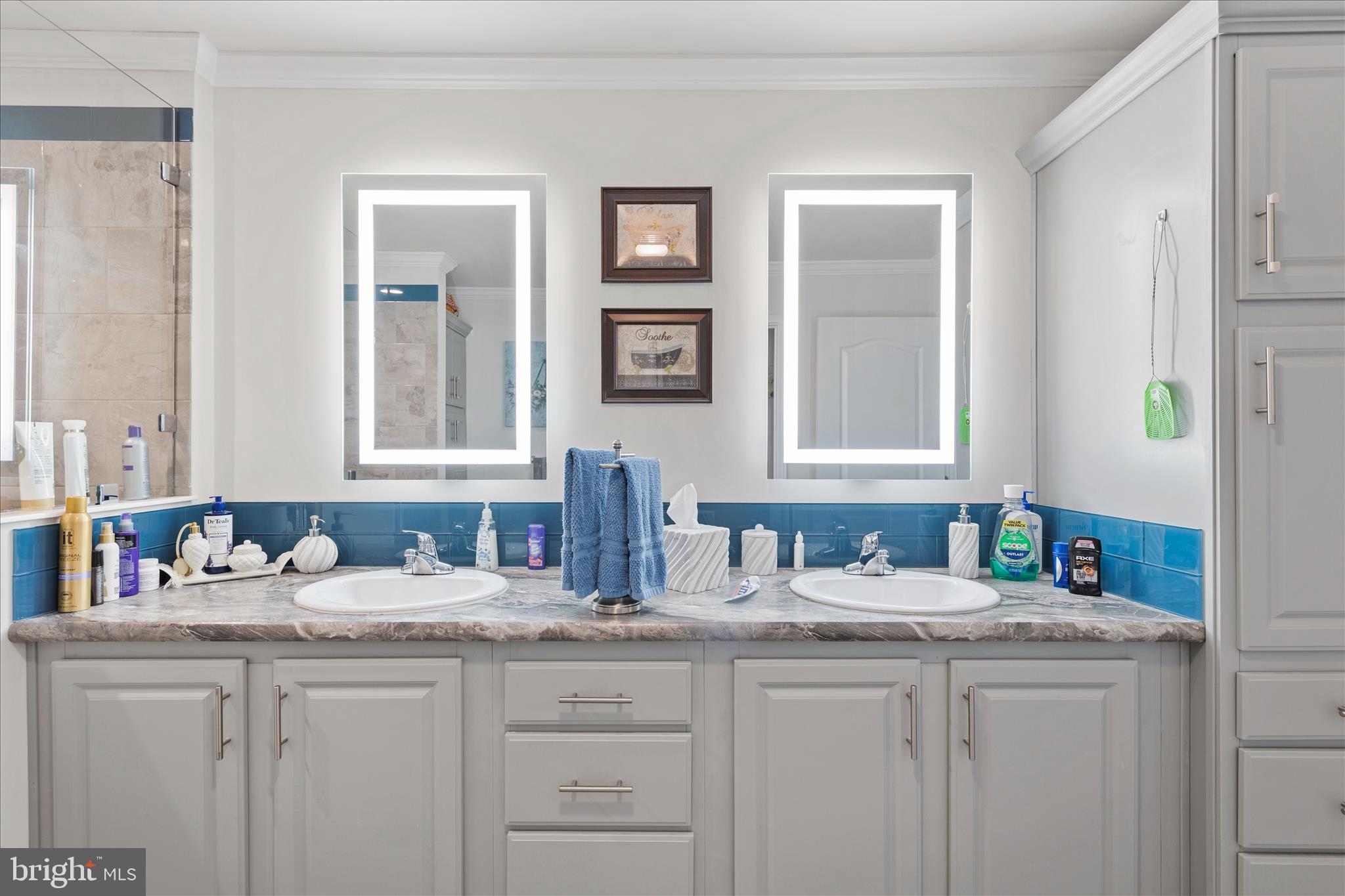 21933 Conrail Road Seaford, DE 19973 - Photo 30 of 35 a bathroom with sinks cabinets and a mirror