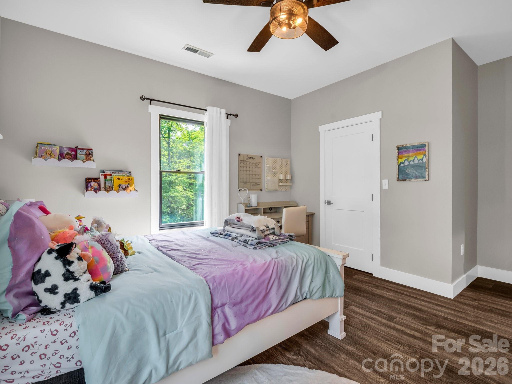 5717 Turnpike Road Horse Shoe, NC 28742 - Photo 11 of 36 a bedroom with a bed and wooden floor