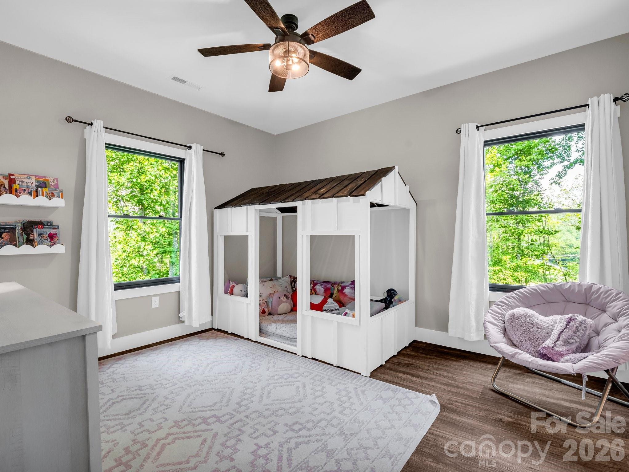 5717 Turnpike Road Horse Shoe, NC 28742 - Photo 13 of 36 a living room with furniture and a large window