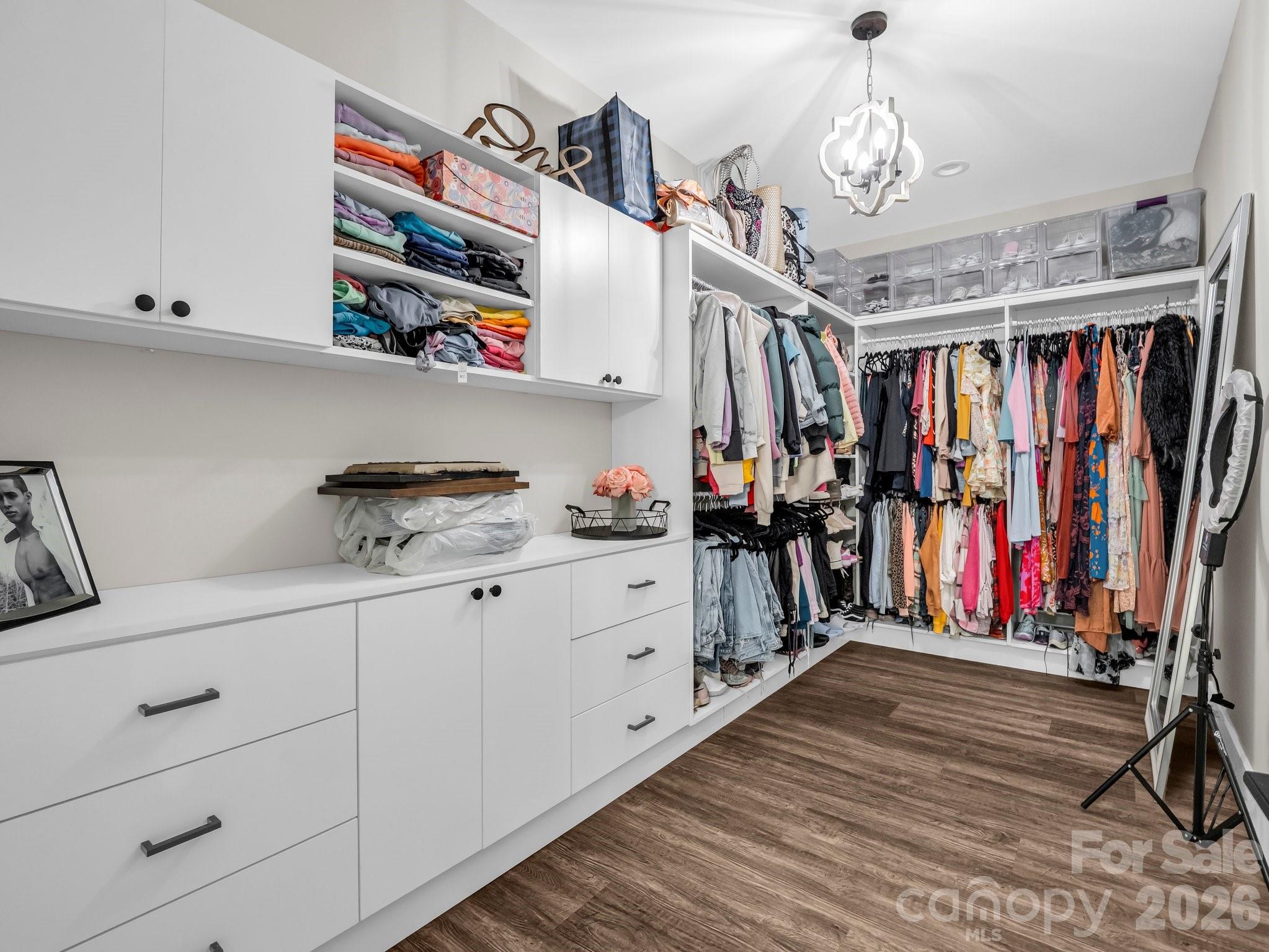 5717 Turnpike Road Horse Shoe, NC 28742 - Photo 15 of 36 a view of walk in closet with clothes and shoes