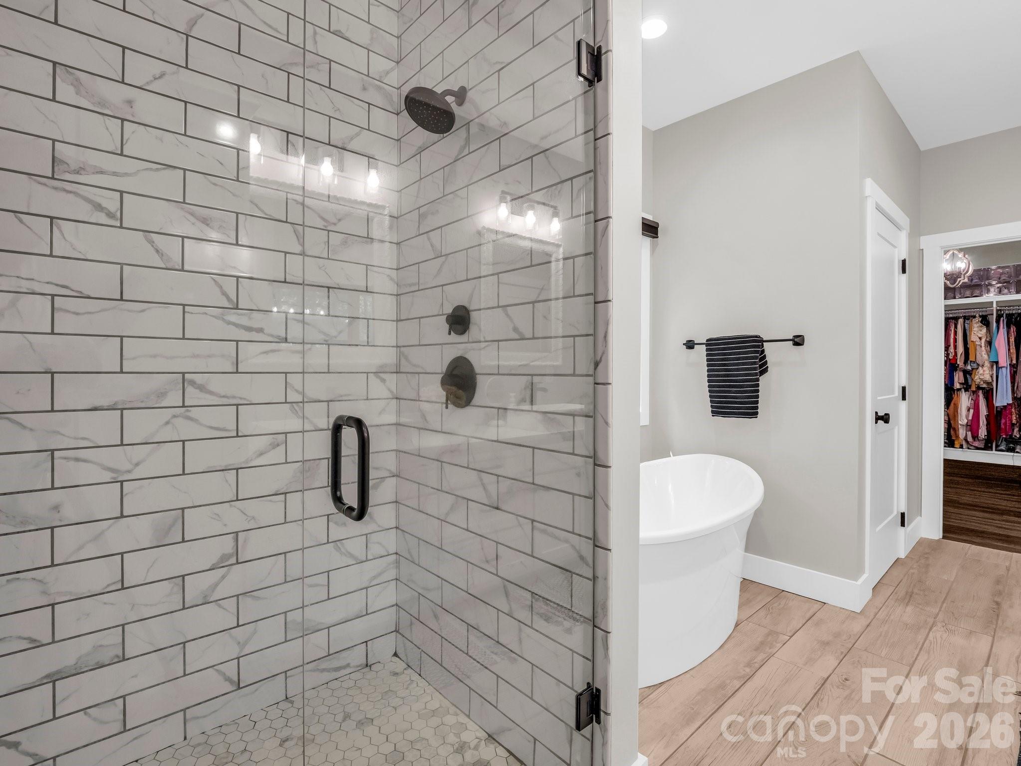 5717 Turnpike Road Horse Shoe, NC 28742 - Photo 16 of 36 a bathroom with a toilet and a shower