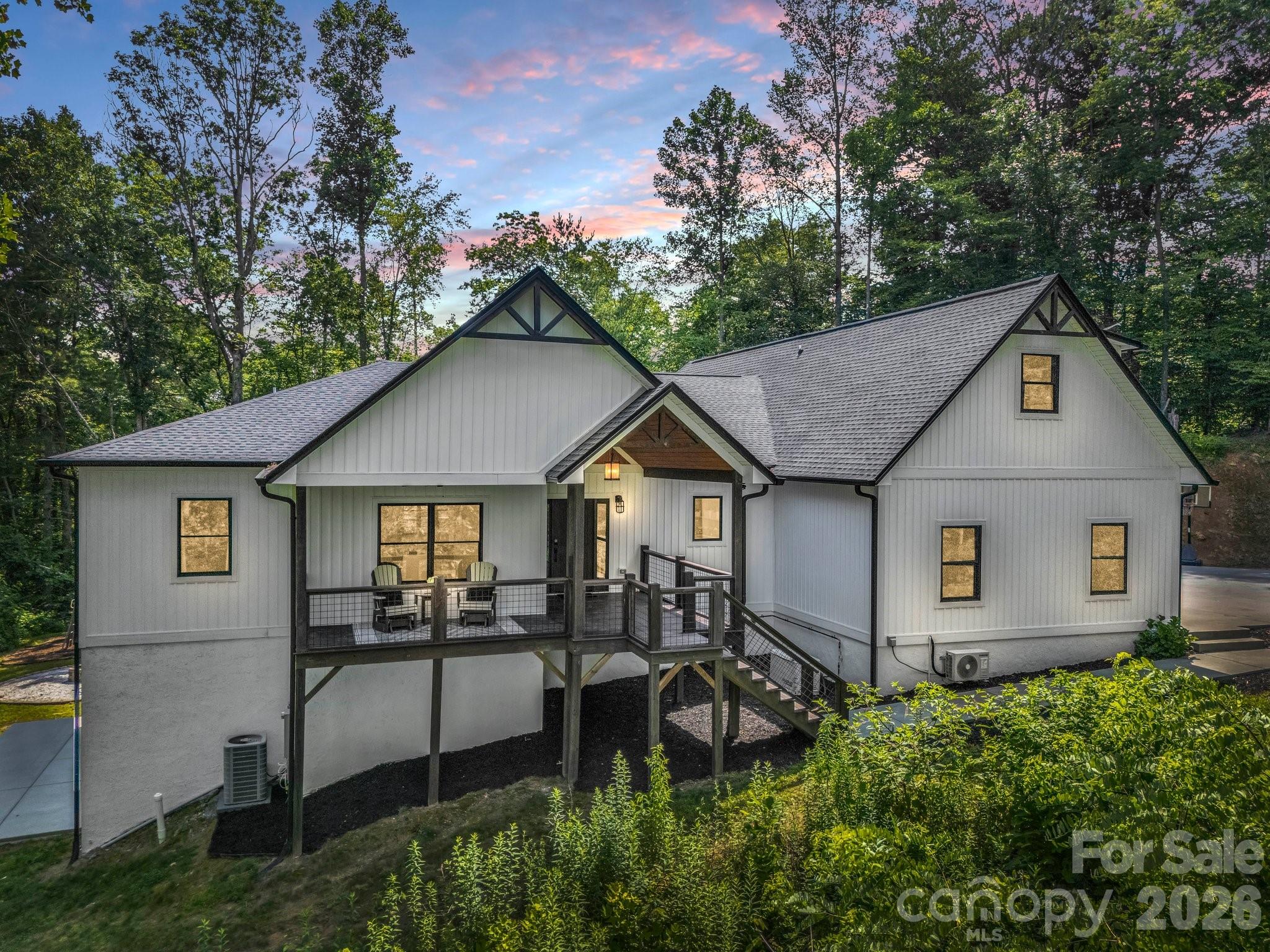 5717 Turnpike Road Horse Shoe, NC 28742 - Photo 2 of 36 a aerial view of a house with yard and trees in the background