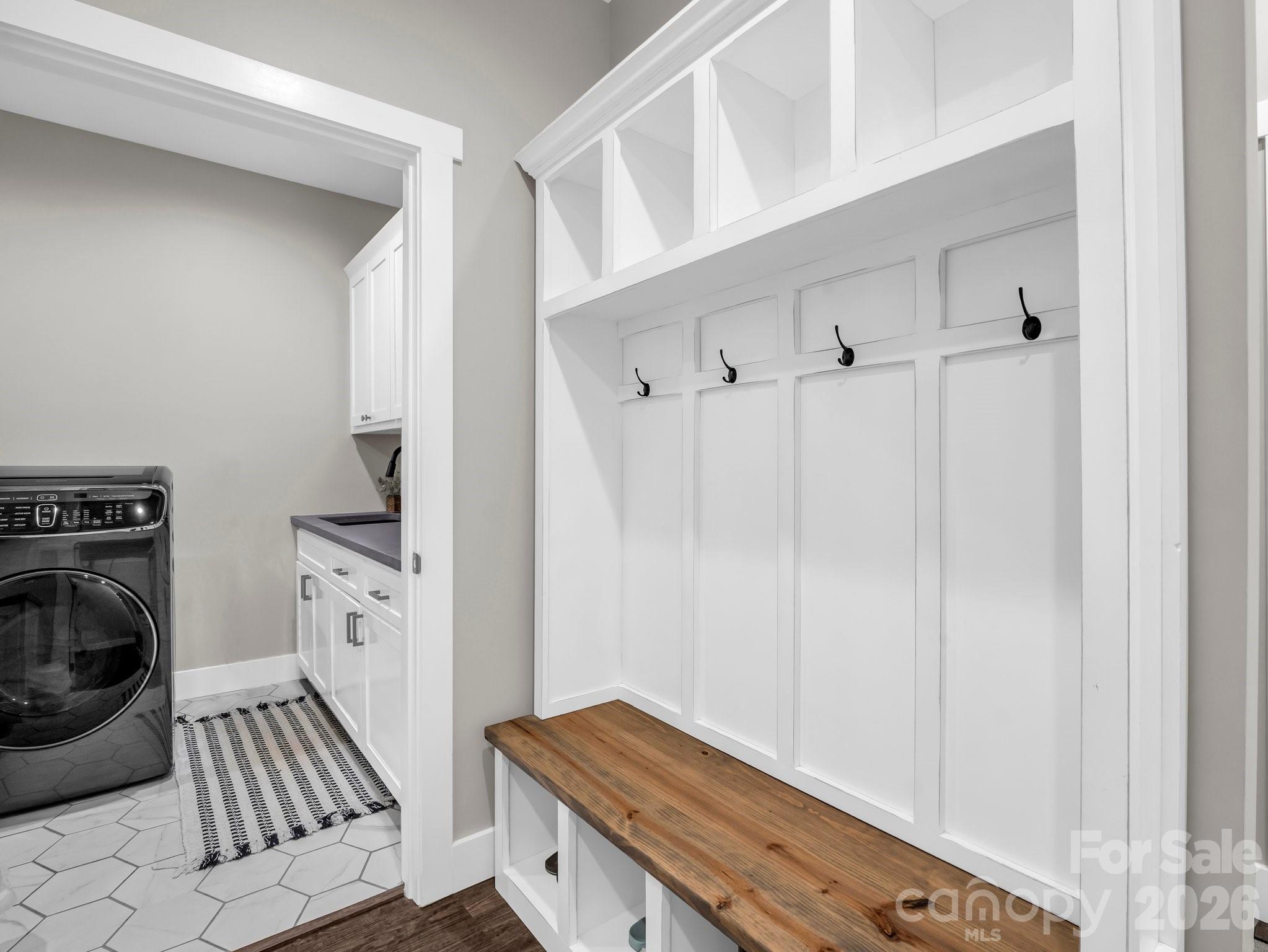 5717 Turnpike Road Horse Shoe, NC 28742 - Photo 22 of 36 a view of a hallway with washer and dryer