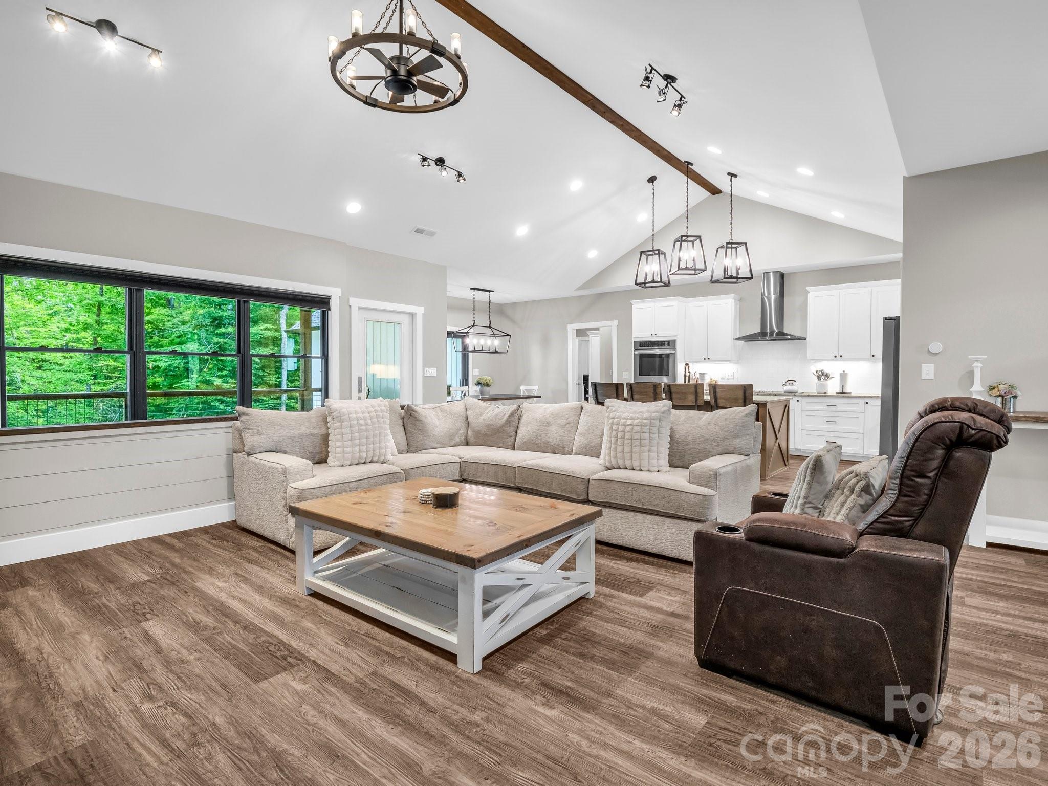 5717 Turnpike Road Horse Shoe, NC 28742 - Photo 28 of 36 a living room with furniture and a large window