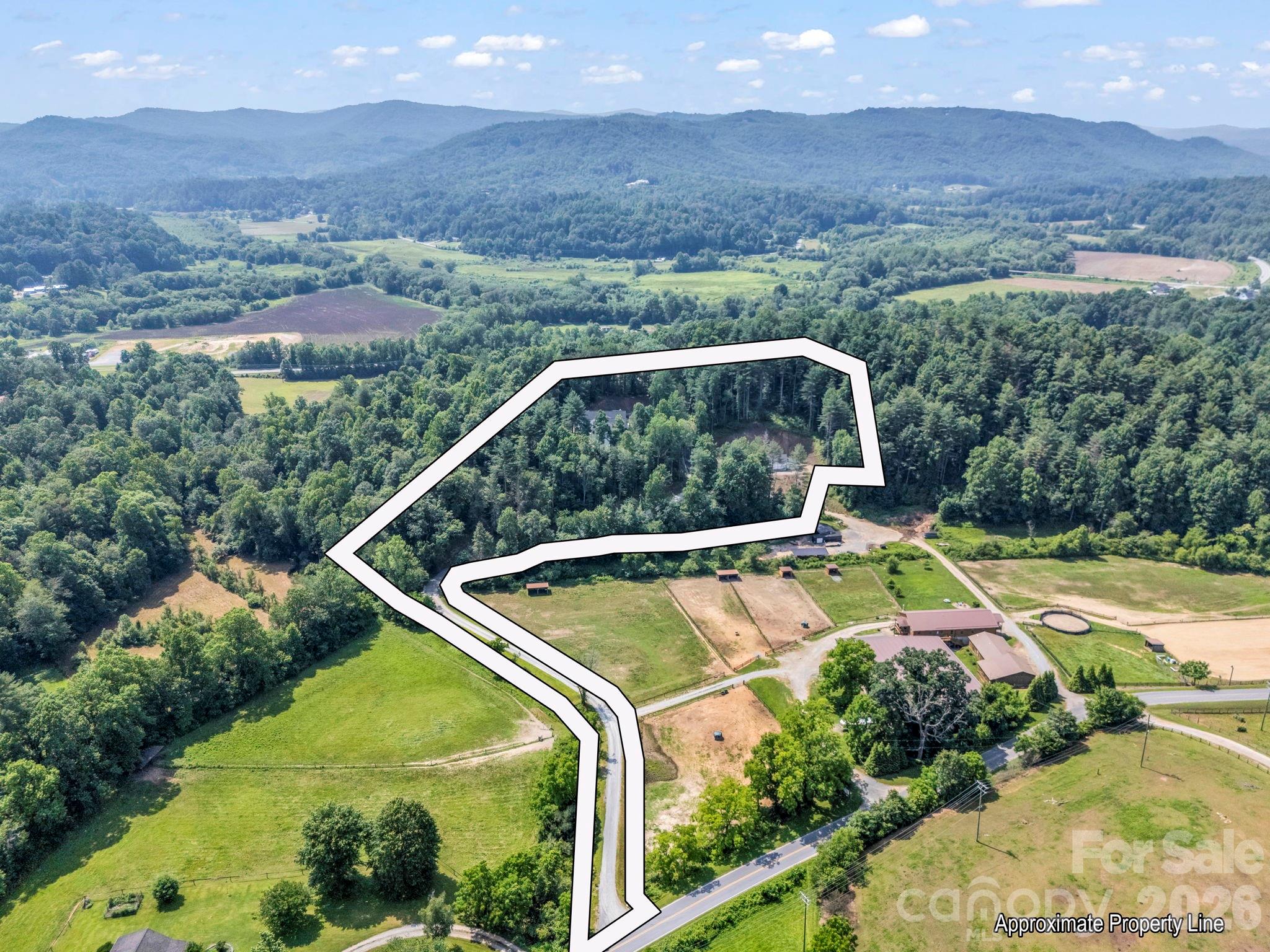 5717 Turnpike Road Horse Shoe, NC 28742 - Photo 3 of 36 a view of a swimming pool with a yard