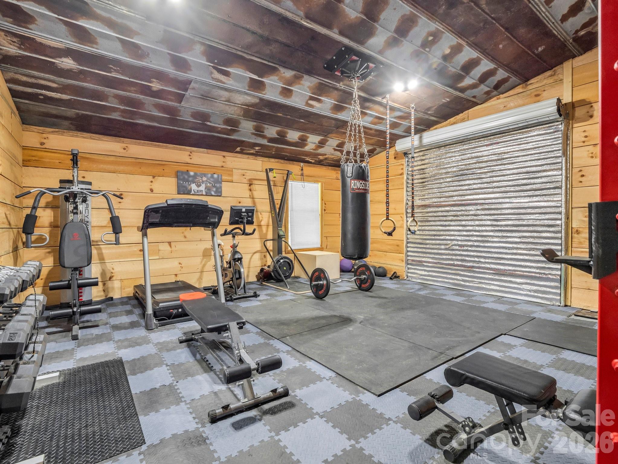 5717 Turnpike Road Horse Shoe, NC 28742 - Photo 32 of 36 a view of a room with gym equipment