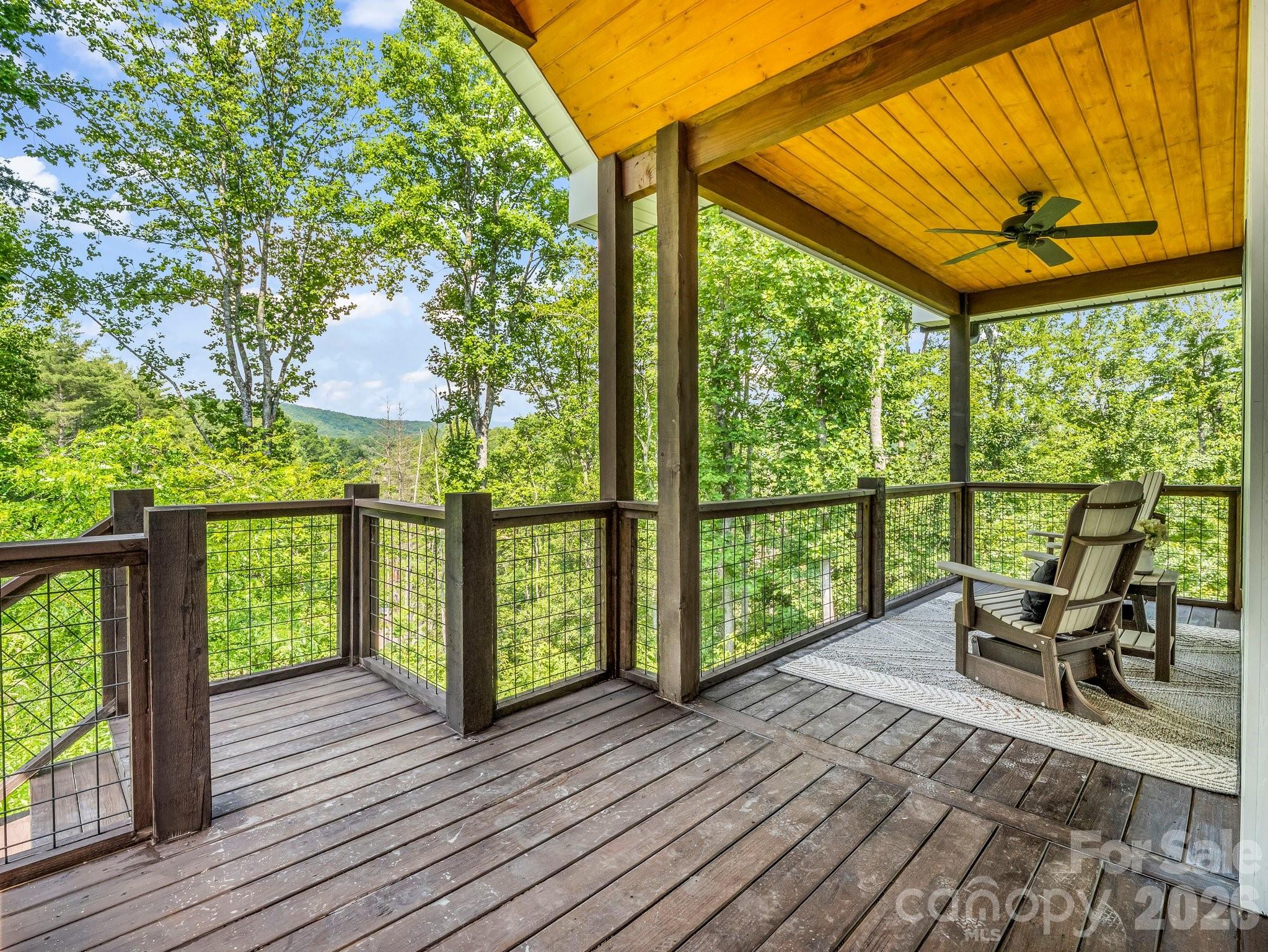 5717 Turnpike Road Horse Shoe, NC 28742 - Photo 5 of 36 a view of a two chairs in the balcony