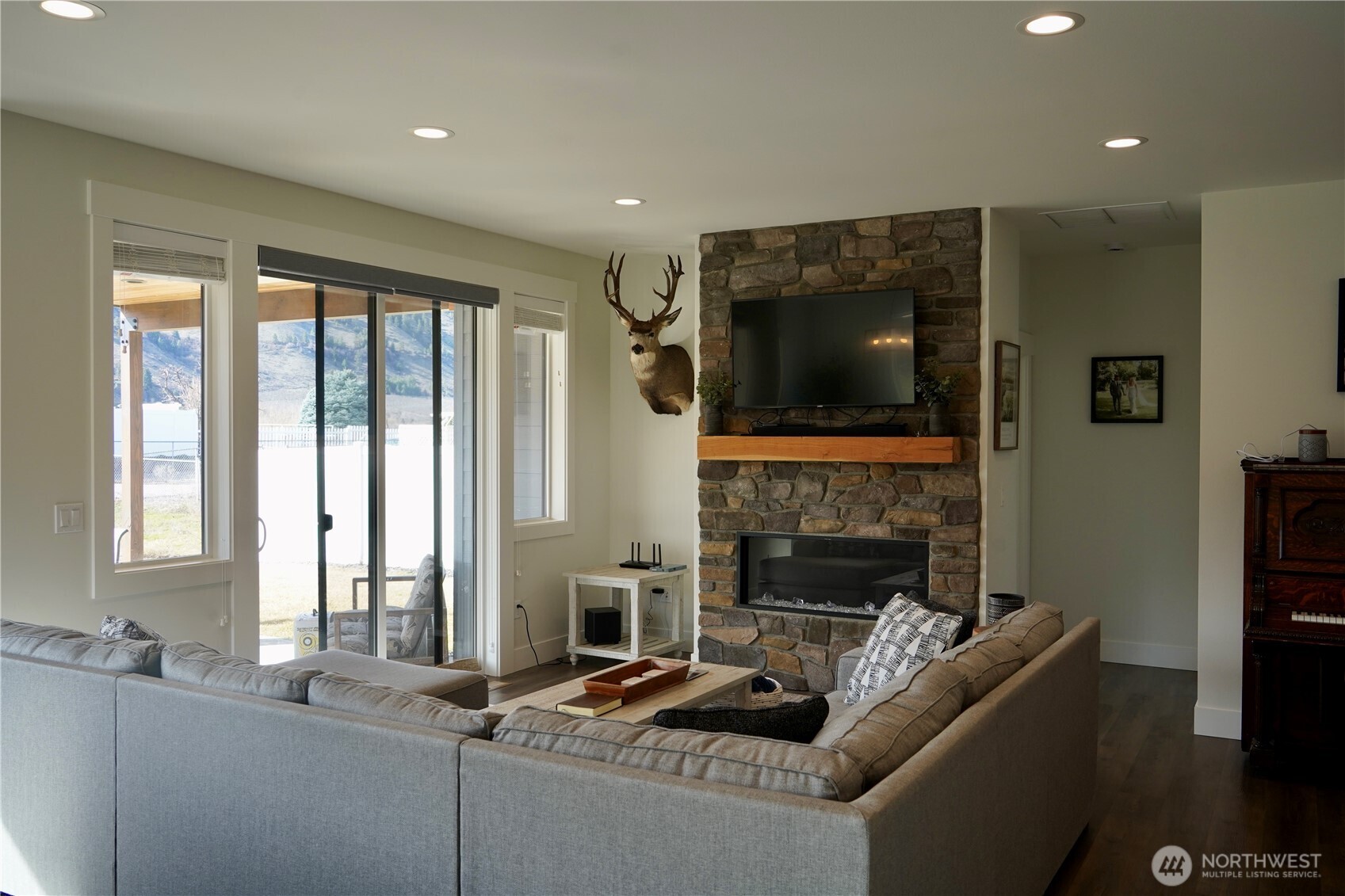 104 Freedom Hills Cashmere, WA 98815 - Photo 11 of 40 a living room with fireplace furniture and a flat screen tv