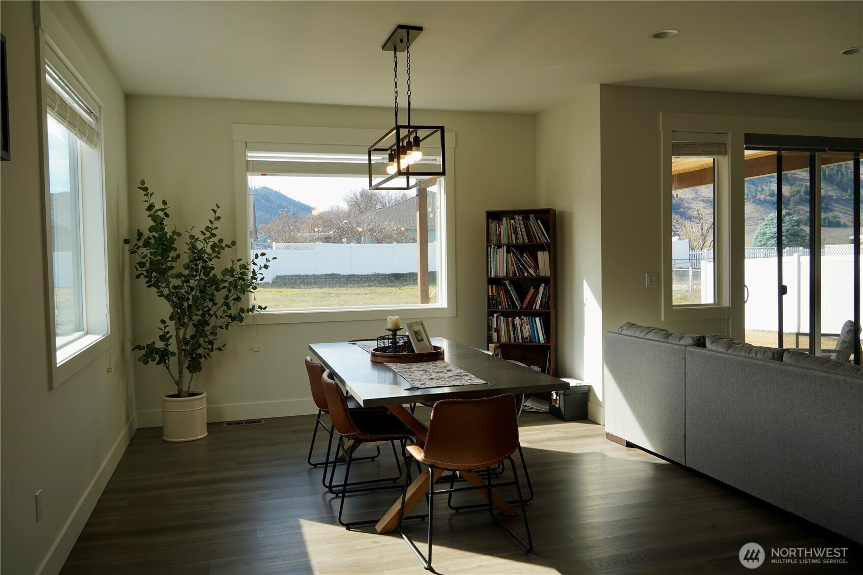 104 Freedom Hills Cashmere, WA 98815 - Photo 15 of 40 a view of a dining room with furniture window and wooden floor