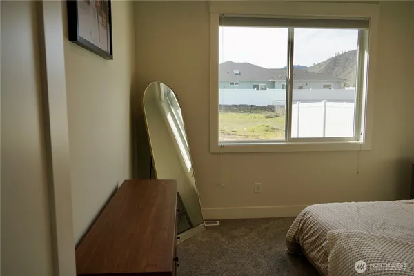 a bedroom with a bed and window