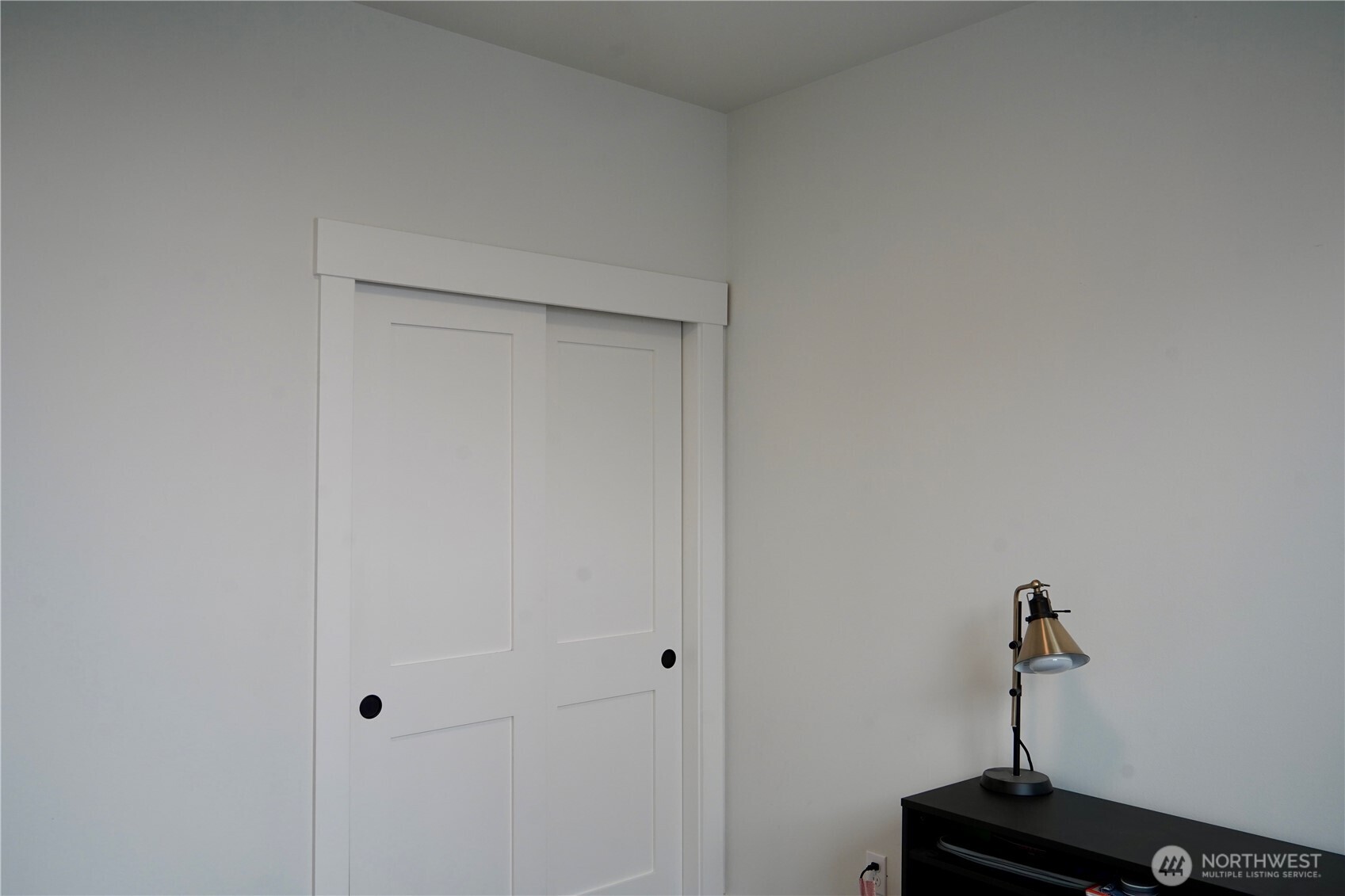 104 Freedom Hills Cashmere, WA 98815 - Photo 34 of 40 a room with a closet and wooden floor
