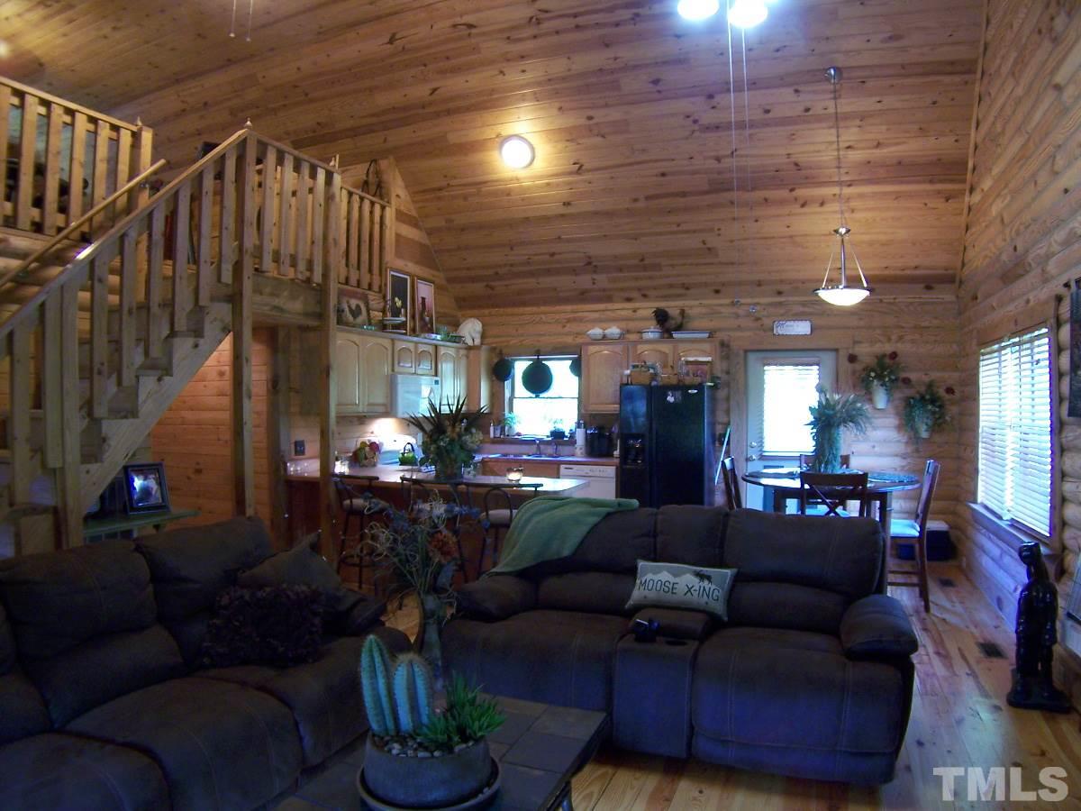239 Rocky Ridge Road Leasburg, NC 27291 - Photo 3 of 23 a living room with furniture and wooden floor