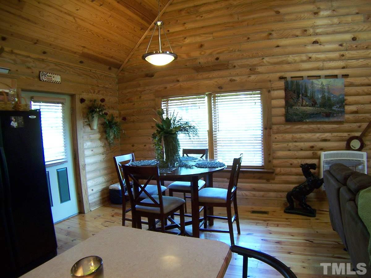 239 Rocky Ridge Road Leasburg, NC 27291 - Photo 6 of 23 a view of a dining room with furniture and window