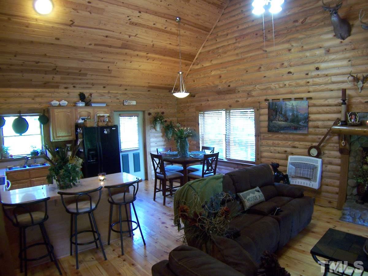 239 Rocky Ridge Road Leasburg, NC 27291 - Photo 7 of 23 a living room with furniture and wooden floor