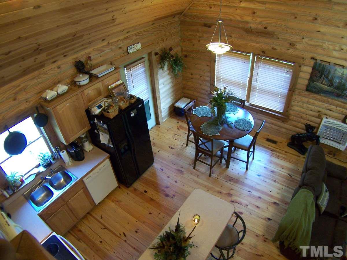 239 Rocky Ridge Road Leasburg, NC 27291 - Photo 8 of 23 a living room with furniture and wooden floor