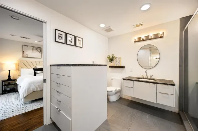 a bedroom with a large bed and a large window