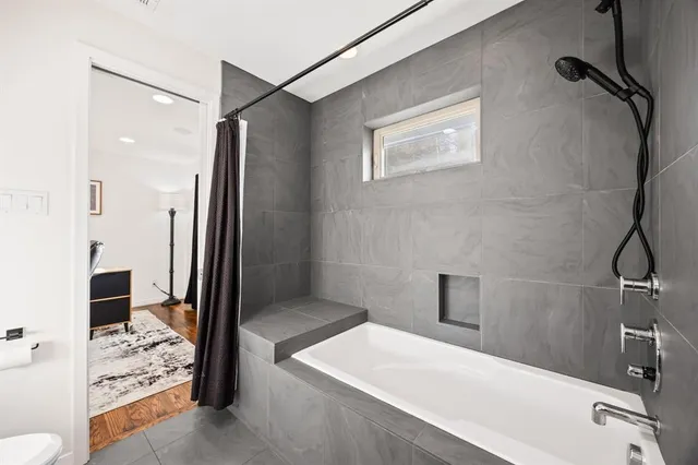 a bed room with a bed and a television