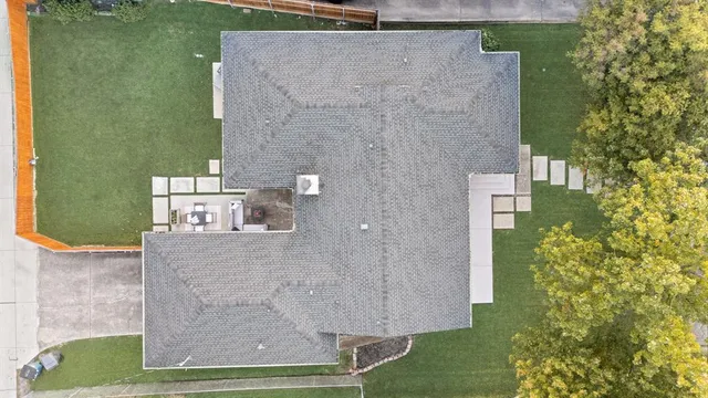 an aerial view of residential houses with outdoor space