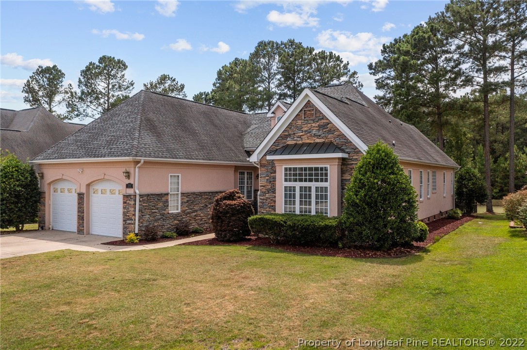 255 Falling Water Road Spring Lake, NC 28390 - Photo 2 of 39 a front view of a house with a yard