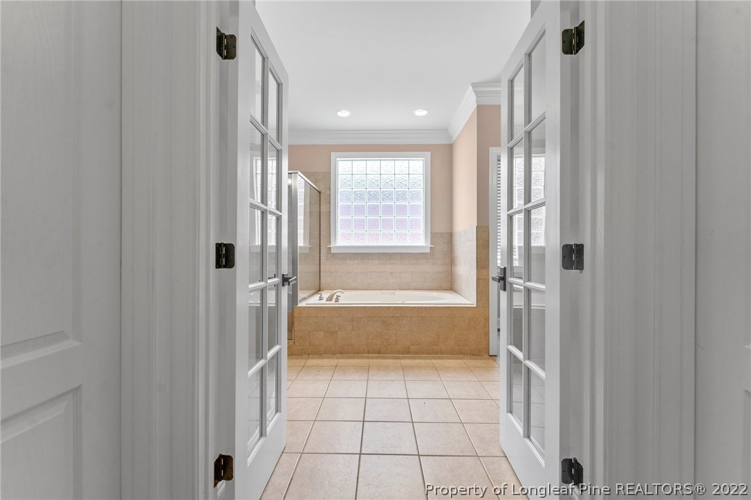255 Falling Water Road Spring Lake, NC 28390 - Photo 24 of 39 a bathroom with a bathtub a shower and a sink
