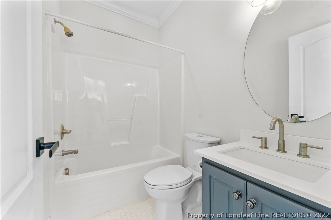 255 Falling Water Road Spring Lake, NC 28390 - Photo 30 of 39 a bathroom with a sink toilet and shower