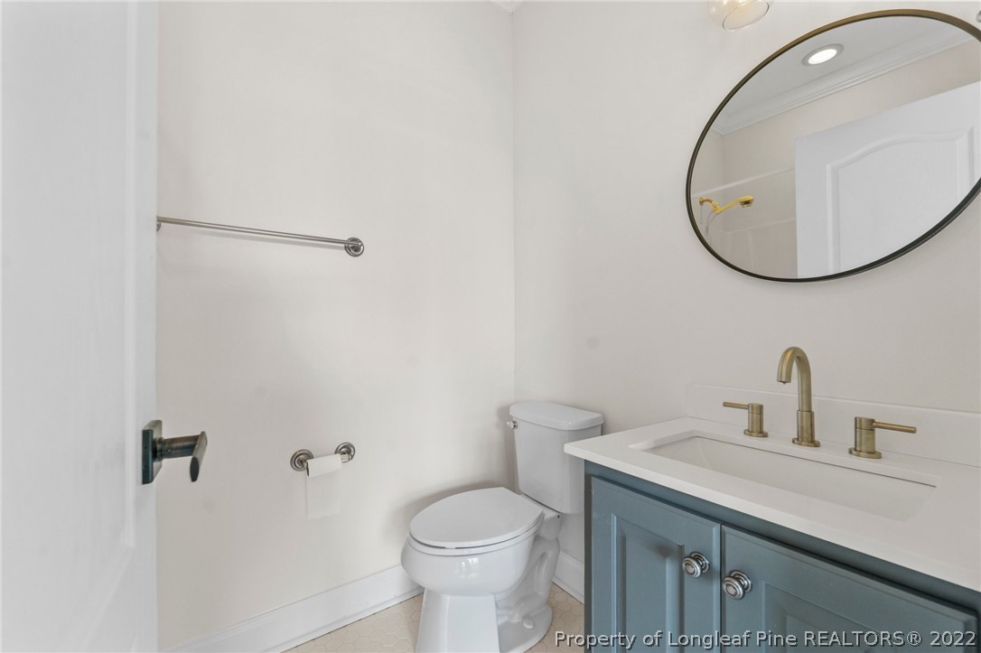 255 Falling Water Road Spring Lake, NC 28390 - Photo 32 of 39 a bathroom with a sink and a mirror