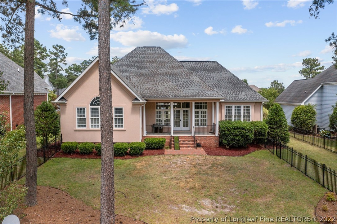 255 Falling Water Road Spring Lake, NC 28390 - Photo 4 of 39 a front view of a house with a yard and potted plants