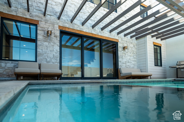 Indoor pool with area for grilling