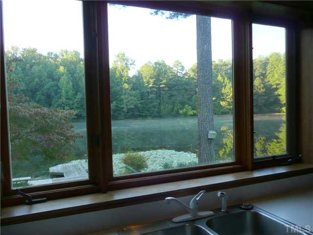 213 Bayleaf Drive Raleigh, NC 27615 - Photo 8 of 25 Gorgeous view of pond from the kitchen sink window. Watch turtles and blue heron while doing the dishes Kitchen