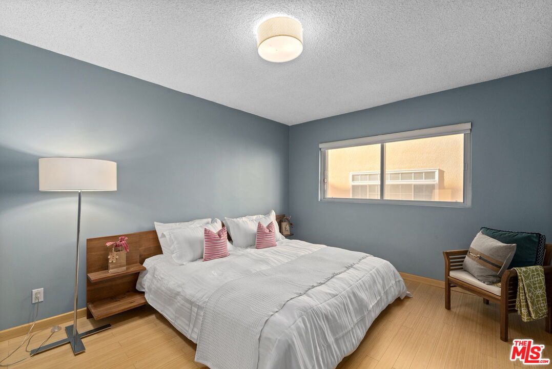 8710 Delgany Avenue, Unit 3 Playa del Rey, CA 90293 - Photo 14 of 21 a bedroom with a bed and a window
